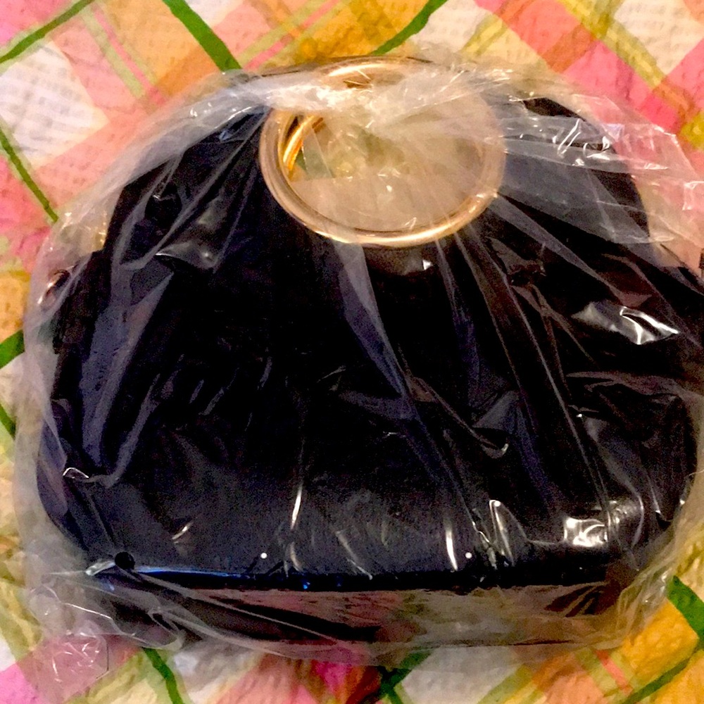 Brand new in plastic small black bag